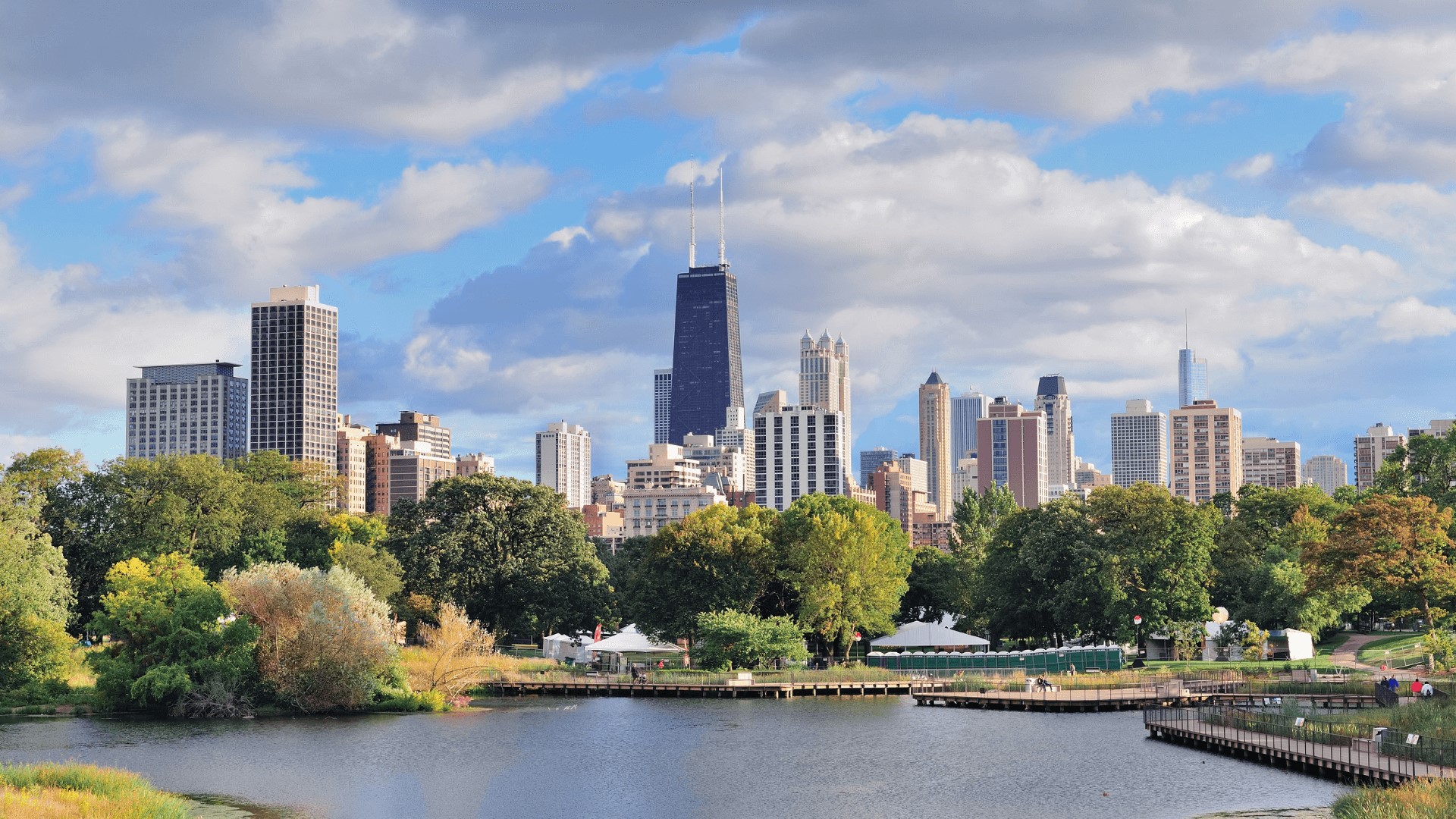a view of the chicago skyline from a park