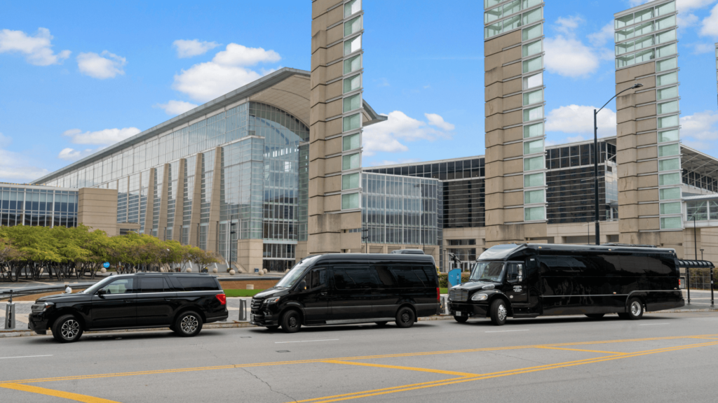 three vans parked in front of a large building in chicago