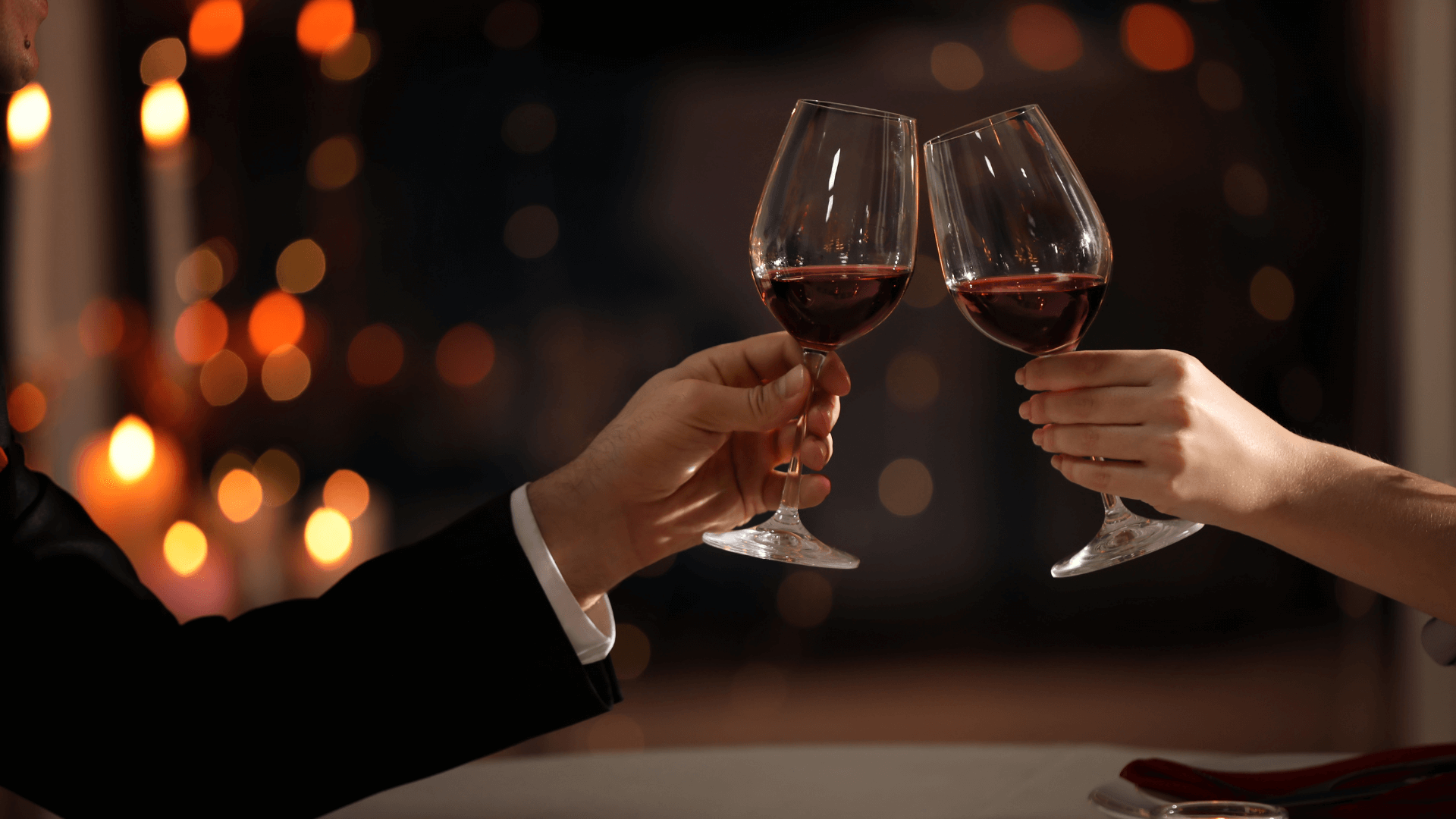 couple giving cheers with glass of wine