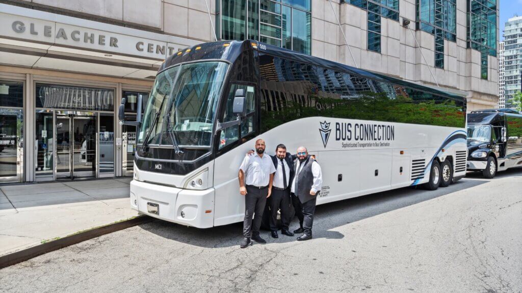 Bus Connection chauffeurs standing in front of Gleacher Center